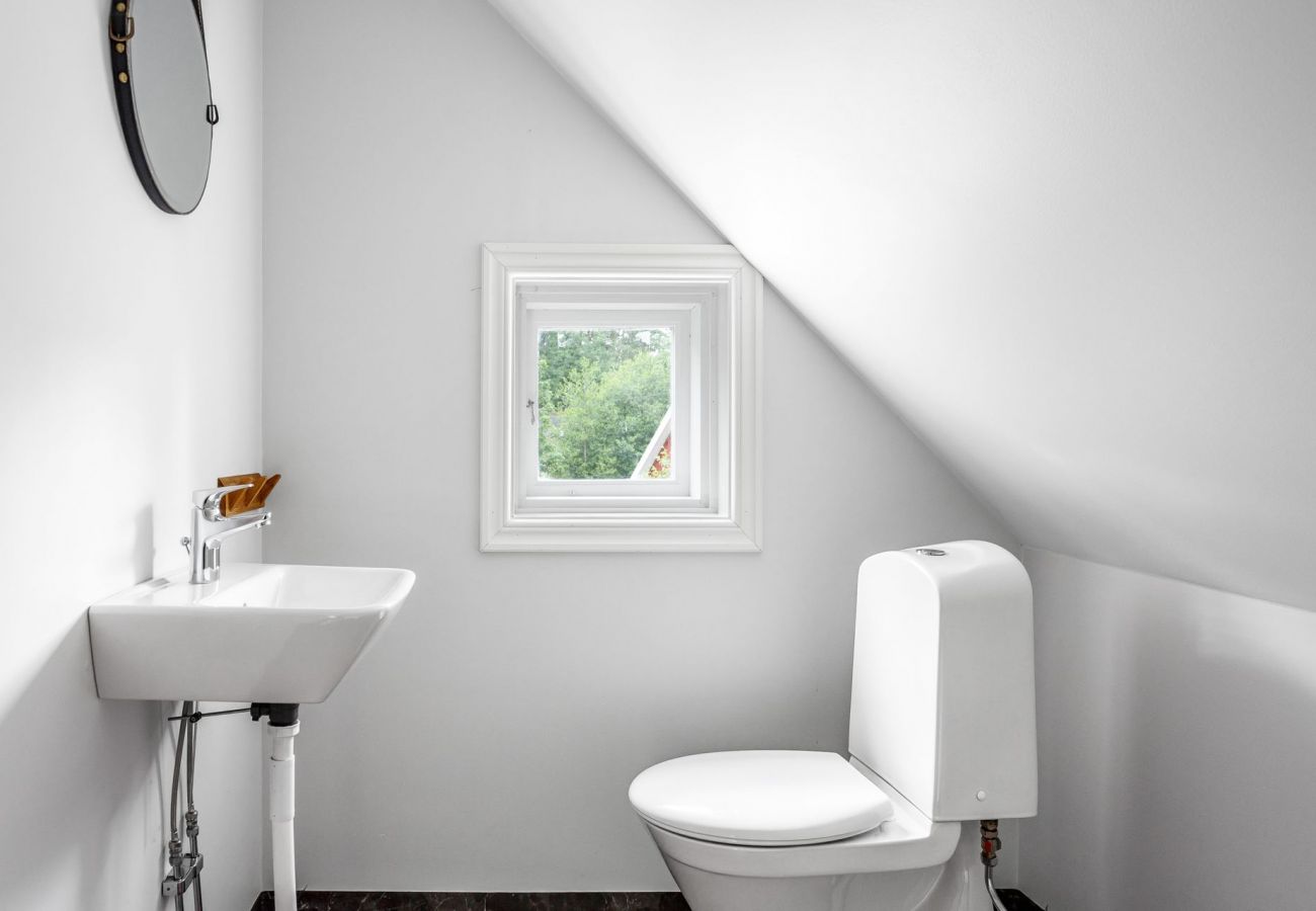 Bright bathroom with sink and toilet