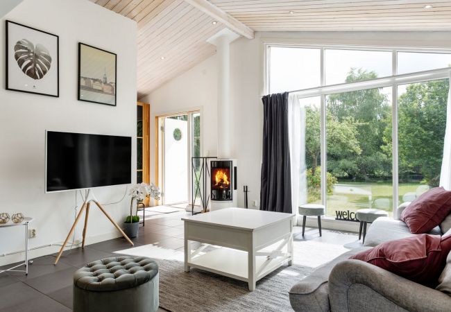 Livingroom with big windows and tv